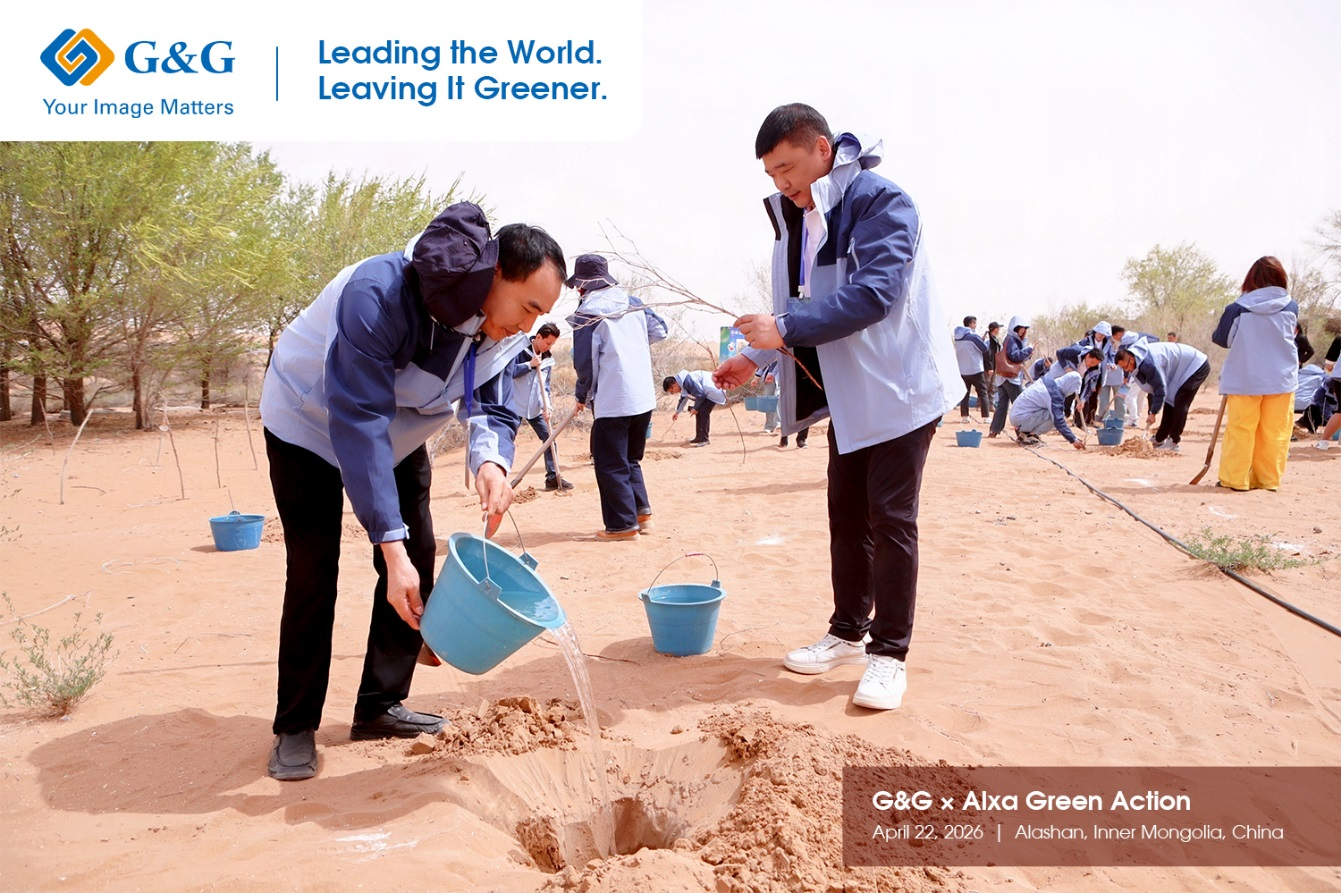 A picture of two G&G employers planting trees